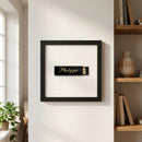 Detailed shot of Philippe framed print in a cozy setting, highlighting high-quality paper finish, wooden frame, and natural light in a balanced composition.