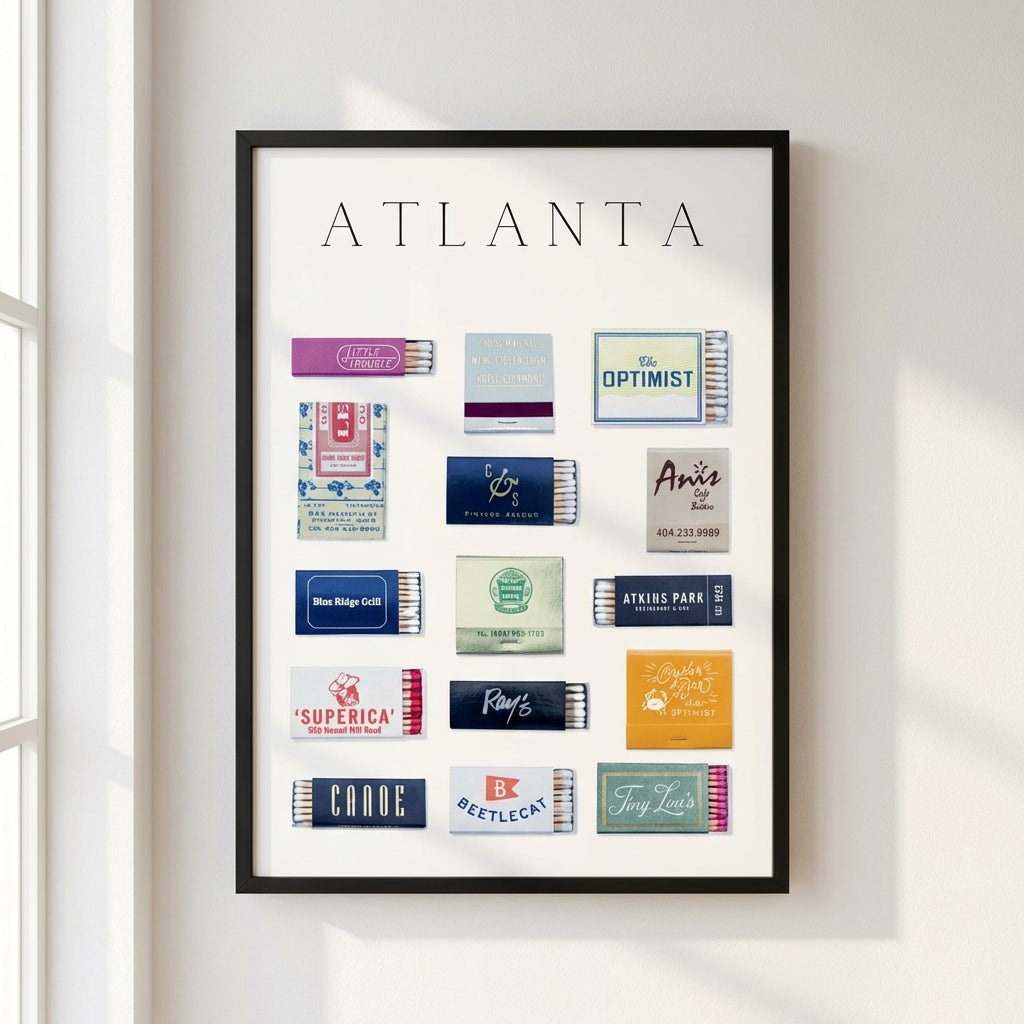 Large 24x36 inch framed Atlanta Matchbox Print on a white wall, highlighting quality materials and detailed art in a cozy room setting.