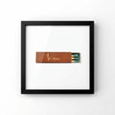 Stylish Buccan poster in a sleek frame displayed on a white wall with natural morning light highlighting craftsmanship and details.