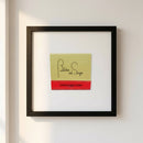 Close-up of the Butcher and Singer framed poster on a white wall, showcasing its textured surface, glossy and matte finishes, and elegant wood frame.