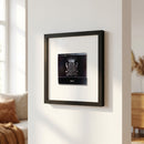 Warm, inviting scene of Carlyle Hotel framed poster in a cozy living space, emphasizing texture, framing, and natural lighting.