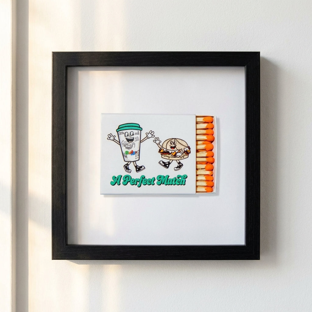 Close-up of Bodegas Framed Print showcasing textured matte paper and sleek black wooden frame with warm natural light.