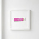 Elegant close-up of the Little Trouble framed print on a white wall, highlighting textured matte paper and sleek wooden frame.