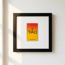 Tao’s Framed Print displayed on a wall in a cozy living space with natural lighting.
