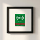 High-quality framed poster of 'Otey’s' in a cozy living room setting, showcasing a glossy and matte finish on high-quality paper with a wood frame.