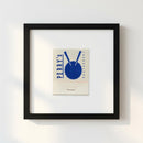 Framed Perrys wall poster hanging in a cozy living room setting with warm natural light and soft shadows