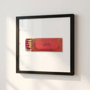 High-resolution framed Don Angie NYC poster on cozy living room wall, illuminated by natural light, showcasing textured paper and wood frame detail.