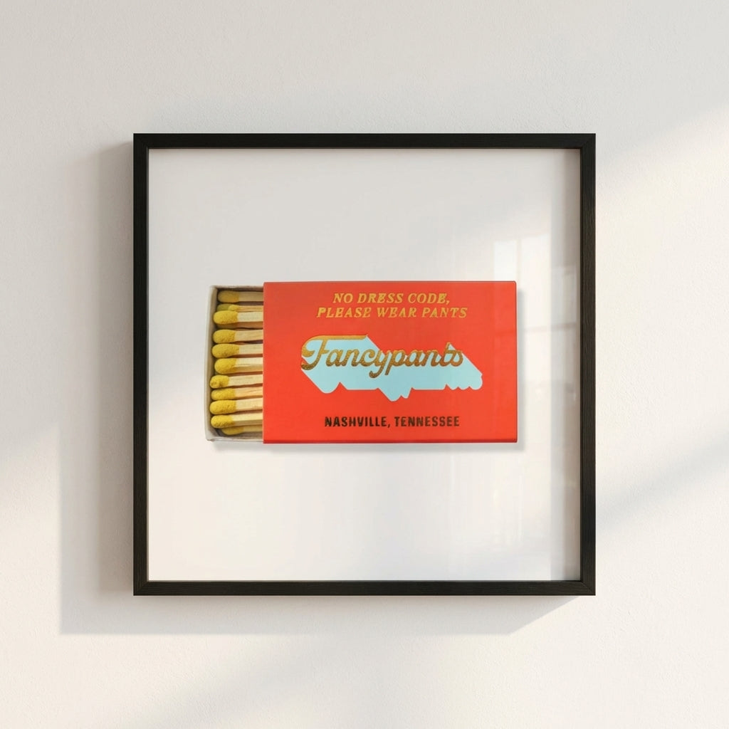 Full view of the Fancypants Nashville framed poster hung on a white wall, highlighting its quality print and natural wooden frame.