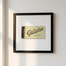 High-resolution framed Gallaghar’s NYC poster hung on a white wall in a cozy setting with natural window light.