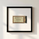 Detailed view of Gramercy Tavern landscape print on white wall, showcasing premium paper and wooden frame in warm daylight.