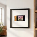 High-resolution image of Havana Honey's framed poster mounted on a white wall, showcasing the thick wooden frame, natural lighting, and inviting home decor.