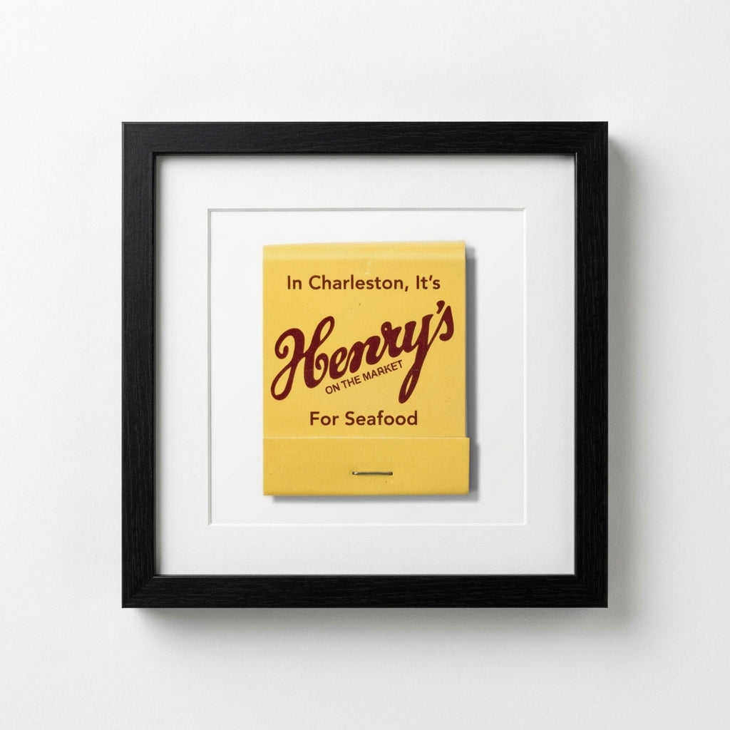 Full view of Henry's Framed Print hanging on white wall in cozy setting, emphasizing 12x12 size, textured paper, elegant wood frame, warm natural lighting.