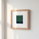 High-resolution image of Hotel Washington poster in a cozy setting, emphasizing natural wood frame and warm, inviting ambiance.
