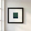 Detailed photograph of Hotel Washington poster framed on a white wall with natural light highlighting the glossy and matte finish.