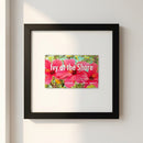 High-resolution image of 'Ivy at the Shore' framed print in a cozy living room with natural warm lighting, black wooden frame, and minimalistic background.