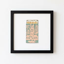 Framed Keys and Heels Speakeasy poster hanging on a white wall in a cozy living room, natural warm light highlighting the glossy and matte finish.