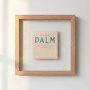 Elegant 10x10 inch framed print of a palm illustration on a white wall, featuring a warm, cozy ambiance with natural light.