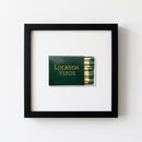 Elegant 10x10 inch black framed print of Locanda Verde on wall, captured with warm natural light highlighting paper texture and crisp edges.
