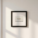 Realistic display of Mamo Framed Print in lifestyle setting with natural warm lighting and wall shadows.