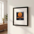 Elegant framed MGM Grand Hotel poster hanging on white wall with natural lighting and wooden frame.