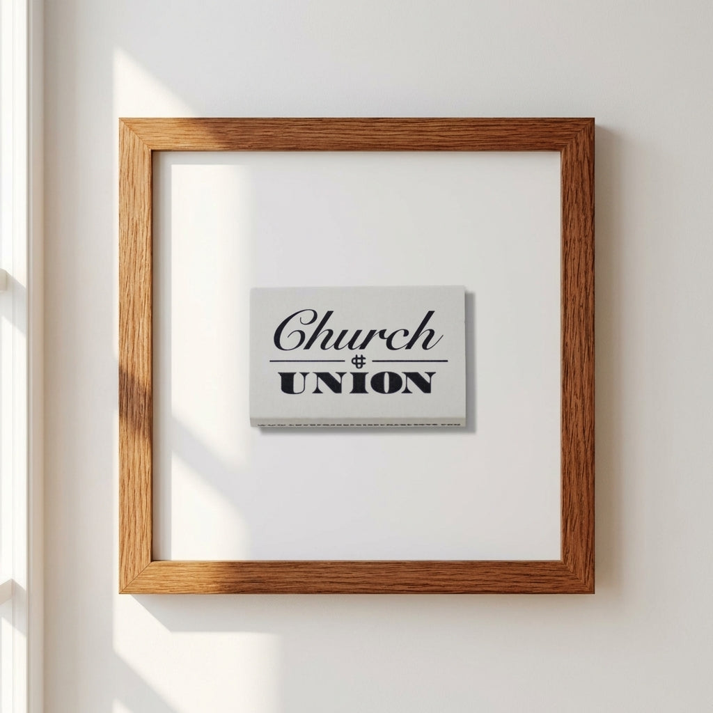 Church & Union framed print displayed in a minimalistic interior with warm sunlight and neutral wall.