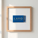 High-quality framed print of a NYC scene hanging on white wall with warm natural light, partly glossy and matte finish.