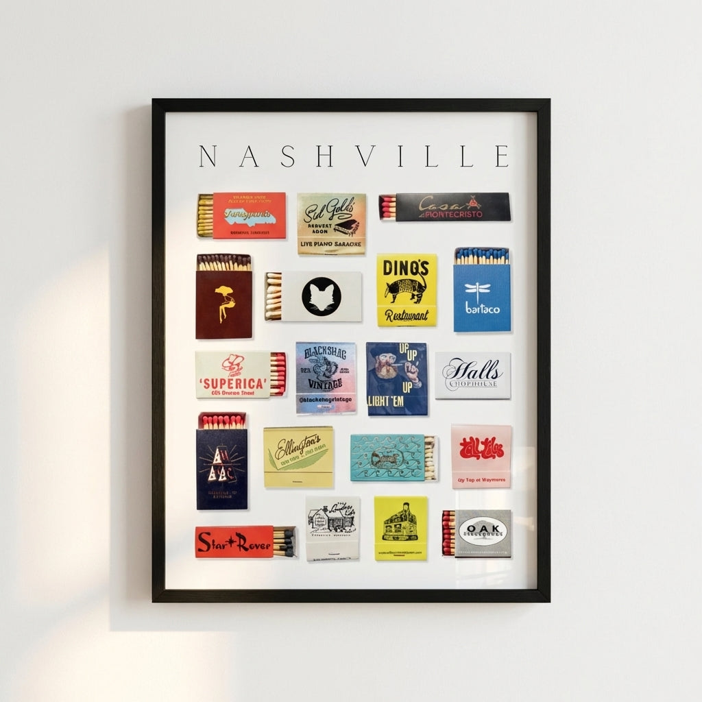 Framed Nashville Matchbox Print poster on a wall, lit with warm natural light in a cozy living room or cafe setting, highlighting detailed textures and warm wood frame.
