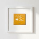 Elegant Oyster Bar Framed Print displayed on a white wall in a cozy living room, featuring a matte black wooden frame and fine textured paper.