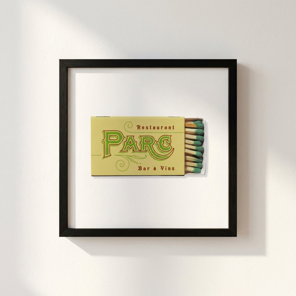 Close-up of Parc Restaurant Philly framed poster on white wall, highlighting craftmanship, micro-texture, and inviting cafe or gallery setting.
