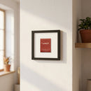 High-resolution image of The Penrose Matchbox framed print, 12x12 inches, in a cozy environment with warm natural light highlighting craftsmanship and texture