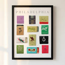 Close-up of Philadelphia framed print mounted on wall, showcasing black Ayous wood frame, matte textured paper, in cozy naturally lit setting.