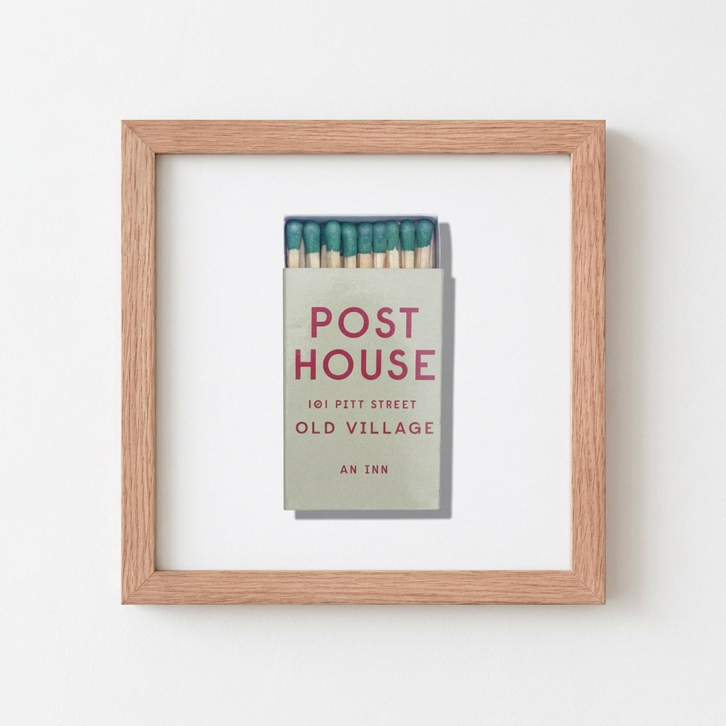 Post House Framed Print in a cozy environment with natural lighting, emphasizing the matte paper, acrylic front, and thick black frame.