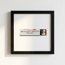 10x10 inch black framed print of Quality Meats hanging on a wall with warm lighting and cozy atmosphere.