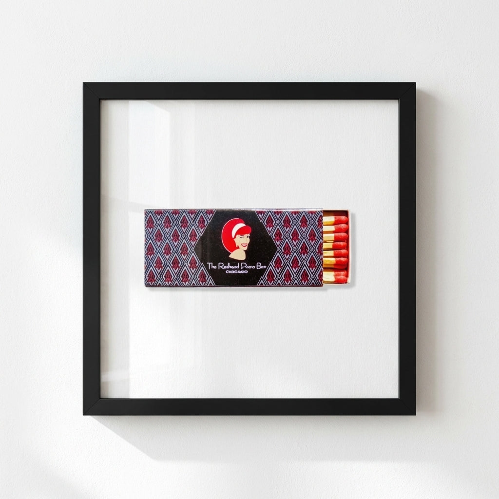 High-resolution image of The Redhead Piano Bar framed print in minimalistic cozy interior with natural window light.