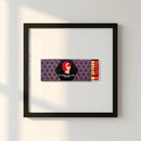 Framed print of The Redhead Piano Bar hanging on textured wall in cozy interior with warm natural lighting.