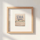 Elegant Serra Framed Print hanging on a white wall, captured in warm natural light highlighting its high-quality paper and sturdy wooden frame.