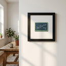 Detailed image of 'The Darling' poster framed in ayous wood in a warm living room setting with natural light.