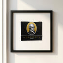 Close-up of The Hamilton framed poster highlighting micro-textural details and wood frame with soft natural lighting on a white background.