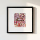 Framed print of The Hotel Chelsea NYC on white background, featuring a wooden frame and detailed paper poster under natural light.