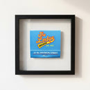 High-resolution image of 'The Lodge Chicago' framed print on a white wall, showing fine details, textures, and warm lighting.