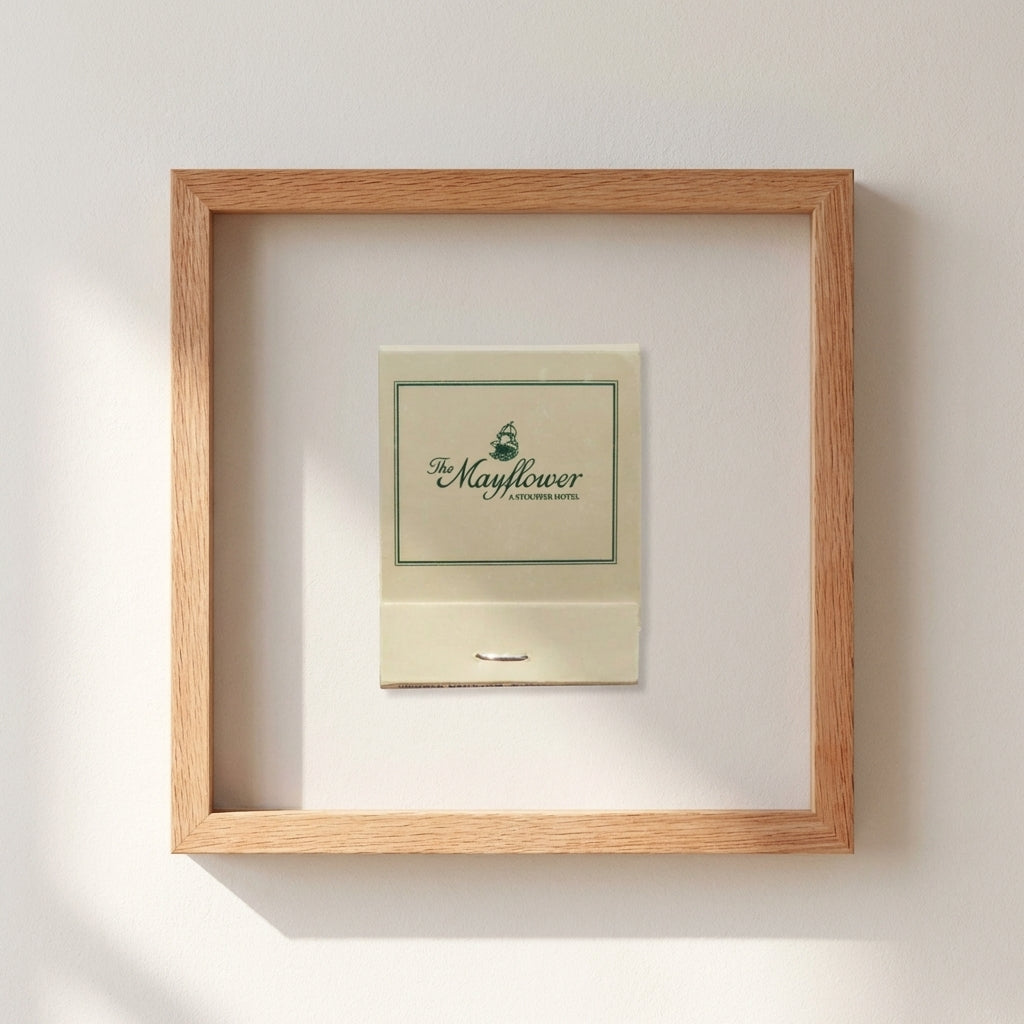 Full-frame shot of 'The Mayflower' in a natural setting, highlighting the red oak wooden frame and acrylic finish with warm lighting.