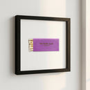 The Pearl Club framed poster hanging in a cozy living room with natural light and wooden frame, showcasing elegance and high-quality print details.