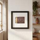 High-resolution image of Via Carota framed print on a white wall in a warmly lit room, emphasizing its high-quality paper and wooden frame.