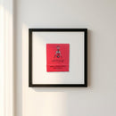High-resolution image of a vintage poster framed and hung on a white wall in a cozy, natural setting with warm lighting highlight.