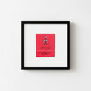 Crisp view of vintage poster in red oak frame on white wall, in a warm, inviting environment with soft natural light.
