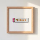 High-resolution shot of Citrus Club framed print on a wall with soft natural light highlighting its matte finish and wooden frame.
