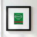 Full view of 'Otey’s' framed poster hanging on a plain white wall, emphasizing the detailed wood frame and premium paper with a soft, inviting light.